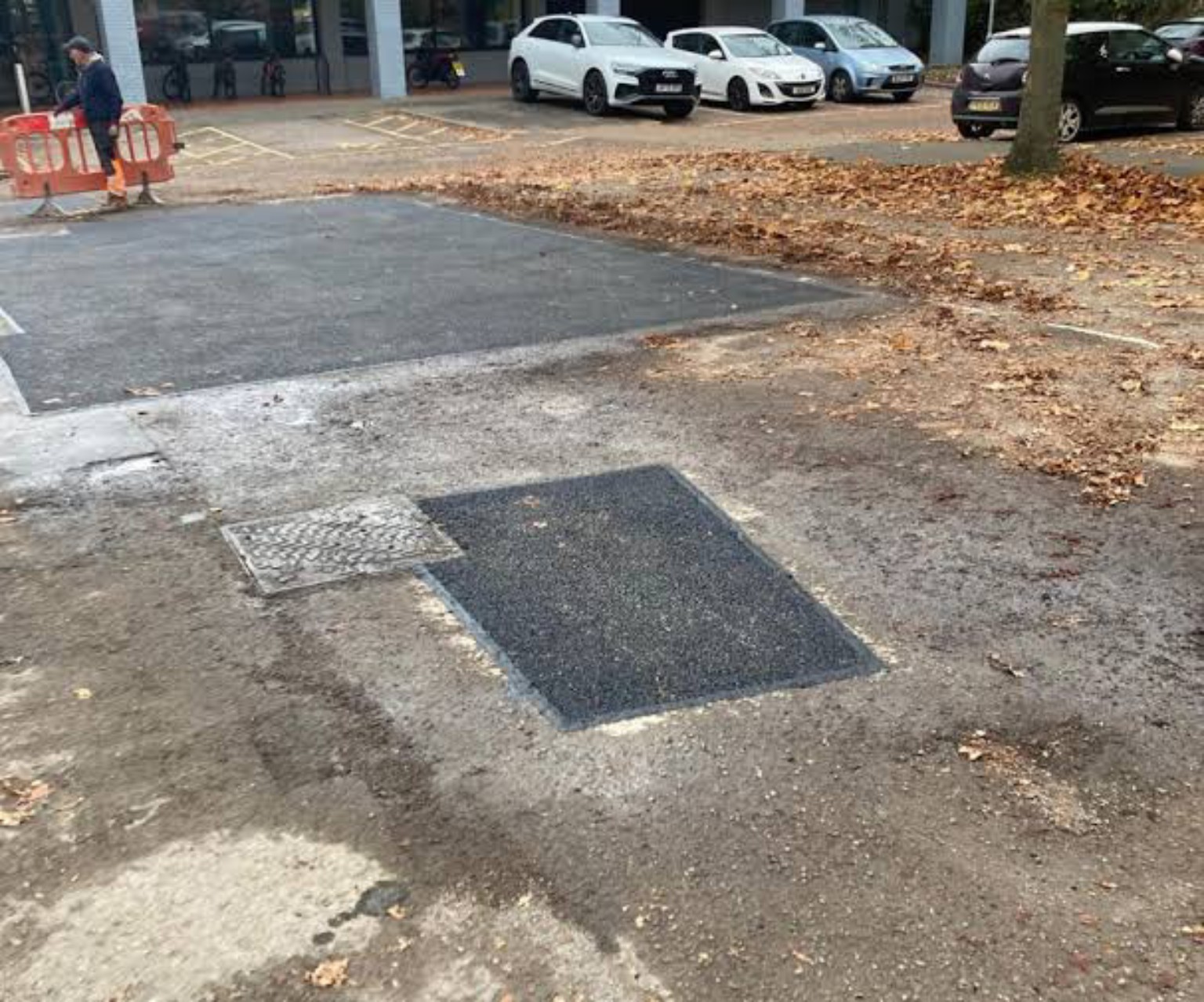 Small tarmac patches in the existing surface at a business centre in Edinburgh