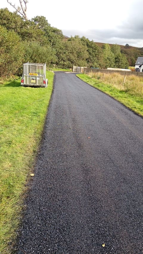 Completed surface-dressed shared roadway near Fort William with a black Armourseal finish