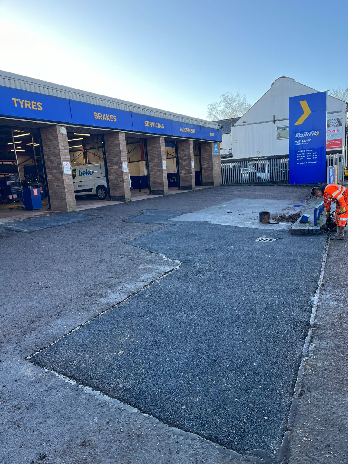 Completed tarmac patch outside a Kwik Fit tyre centre in the Scottish Borders